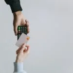 Modern contactless payment using a card and terminal, highlighting the ease of digital transactions.