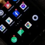 Close-up of a smartphone screen displaying various social media and app icons.